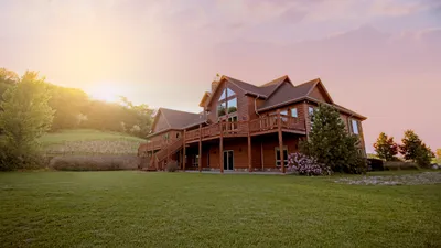 Large house with gutters and roofline visible