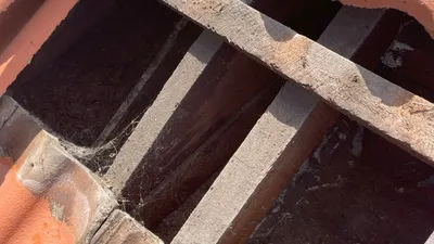 Close-up of roof structural timber showing potential sagging concerns