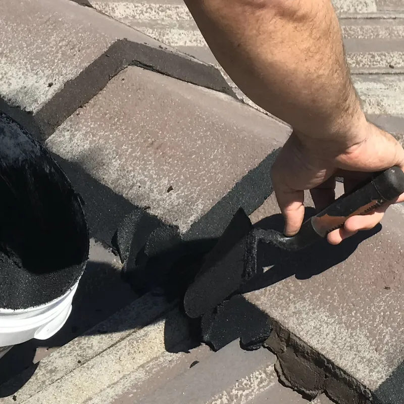 Fresh flexible pointing applied to ridge caps on a Perth tile roof