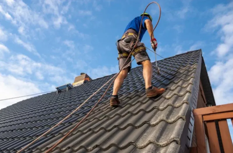 A homeowner practicing roof safety