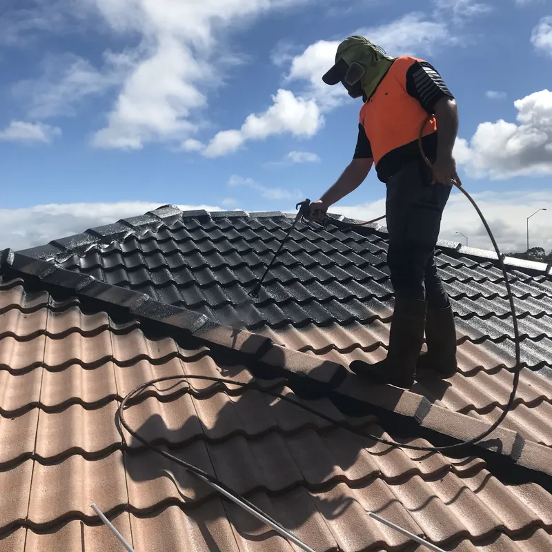 A Perth tile roof being recoated after repairs and a high-pressure clean